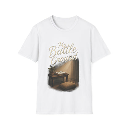 White t-shirt with a graphic design of a room with a desk and chair, and text 'My Battle Ground'.